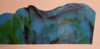 Cut off edge of rolled glass sheet
